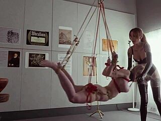 submissive bondage puppet rebel rhyder sucks cock and eats ass in a demented threesome game, getting spanked and dominated by maledom master.