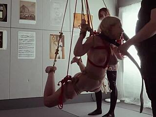 submissive bondage puppet rebel rhyder sucks cock and eats ass in a demented threesome game, getting spanked and dominated by maledom master.