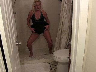 Kinky blonde milf strips in bathroom for dirty talk roleplay. She shows off pierced nipples and shaved pussy while peeing close up.