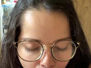 Nerdy brunette with big natural tits gives deep blowjob to Wellington Prado's big cock in jeans shorts by the mirror.