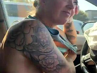 Girl attempting to adjust her sports bra in the gym parking lot