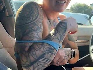 Girl attempting to adjust her sports bra in the gym parking lot