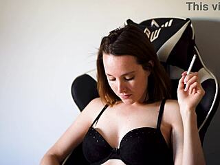 Busty Brunette Babe With Blue Eyes And Cute Petite Figure Smokes In Black Bra