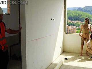 They were having exhibitionist sex on the rooftop when the construction worker joined in and fucked them passionately.