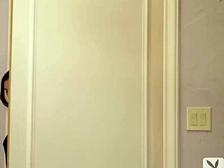 playboy model natalie negodina poses in black lingerie as a brunette with striking features