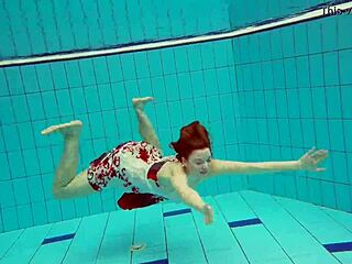 Hot underwater teen Marketa swims in bikini at the pool with petite European body
