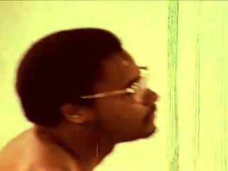 in a captivating vintage setting, an interracial threesome unfolds with intense anal action and group dynamics from classic pornography era