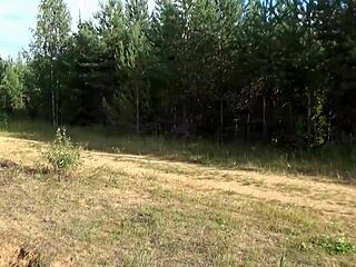 Hot milf struts in nature wearing holey tights.