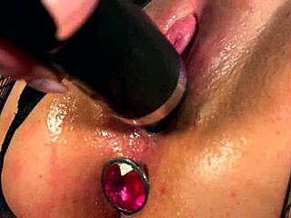 cute bitch with plug in ass fingers tight vagina gently with vibrator on camera