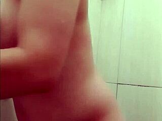 Hot young 18+ woman enjoys shower time while getting her small tits and body waxed