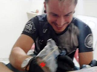 She decided to get a new tattoo while keeping a special accessory in place for added thrill during the session