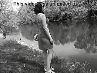 Sweet beautiful cute sexy girl Assol teases in erotic music video clip. She flashes panties and shaved pussy outdoors in skirt and lingerie solo.