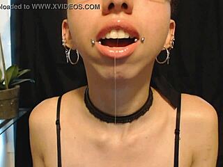 The cute goth teen puts on nude colored lipstick, letting saliva drip and drool all over her pretty wet tongue.