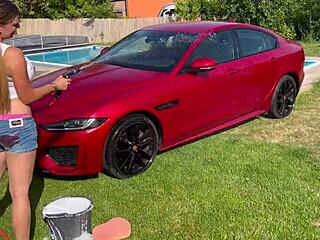 sexy car wash fun with lenushka doll using a wet hose on a hot summer day