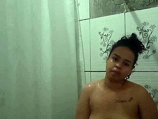 Brunette Latina teen orgasms in POV while fingering her pussy in the shower