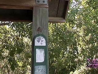 Tattooed brunette strips nude in public park flashing shaved pussy