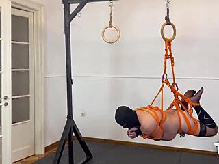 Bound couple uses strapon dildo for femdom anal fisting domination