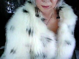 Mature bitch in beautiful fur coat masturbates with dildo showing shaved pussy and big natural tits
