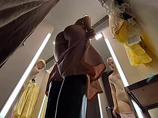 Spy cam catches naked young blonde flashing big tits upskirt