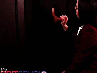 in the dim gloryhole booth a blue-eyed student in lingerie deepthroats cock swallows cum and gets facial from neighbor