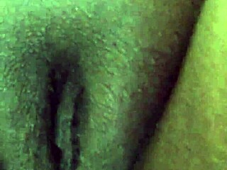 ebony babe squirts wildly all over the living room sofa?