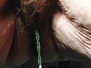 hey oma stuffs that cucumber deep in her hairy granny pussy