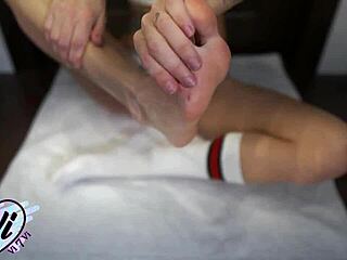 brunette teen oils tattooed feet for close-up fetish tease