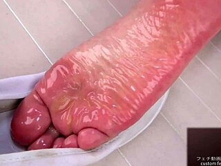 hear her moan as lotion slicks japanese soles in foot fetish play