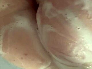 Horny British coed squirts toys in steamy shower solo