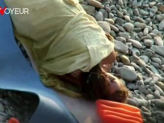 Voyeur teens fuck passionately on public beach