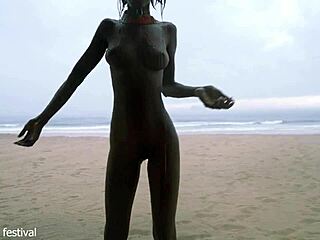 skinny ebony babe dances naked on the beach showing off her small waist and tits