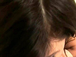 Brunette beauty in lingerie sucks big natural tits tease