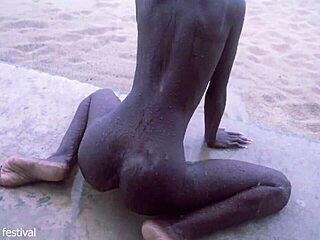 skinny ebony babe dances naked on the beach showing off her small waist and tits