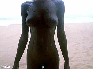 skinny ebony babe dances naked on the beach showing off her small waist and tits