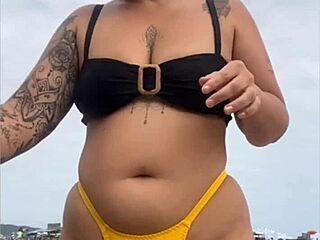 wearing that tight yellow bikini splitting my pussy for beach stares?