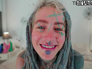 hey watch this heavily tattooed skinny goth girl with pierced nipples rip clothes and fuck herself hard missionary style with huge bedroom dildo to orgasm