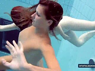 katrin and lucy flaunt big tits underwater at beach pool