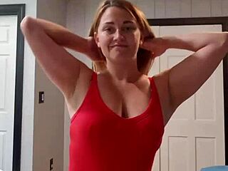 watch this brunette wife strip teasing to music with big tits