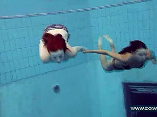 katrin and lucy flaunt big tits underwater at beach pool