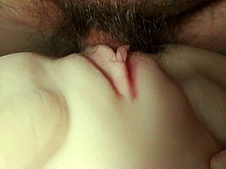 Who's stretching this fuck doll's big shaved pussy and ass with double toys up close?