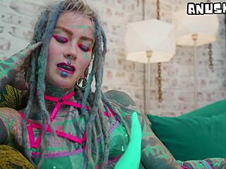 heavily tattooed girl experiments with anal toys solo in lingerie