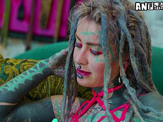 heavily tattooed girl experiments with anal toys solo in lingerie