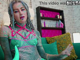 heavily tattooed girl experiments with anal toys solo in lingerie