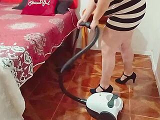 the cheating husband sneaks up on the maid while she vacuums the floor