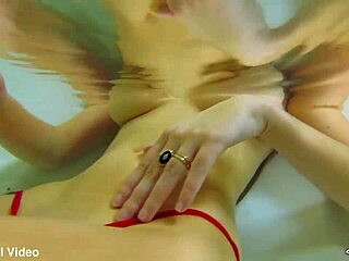 sky blue's micro bikini clings to her wet pussy closeup