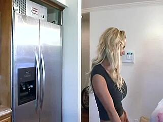 A BLONDE bombshell WITH BIG FAKE TITS rides cock in kitchen