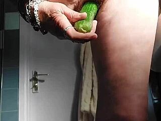 Granny rams cucumber deep in pussy!
