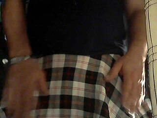 cd stands before mirror pissing in crossdressing fetish display