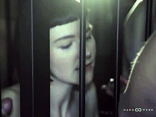 Hardwerk Pounds Bound Petite Brunette Delfine in Cage Orgy with Monster Cocks.