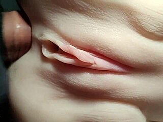 Close-up doll double penetration stretches shaved pussy wide